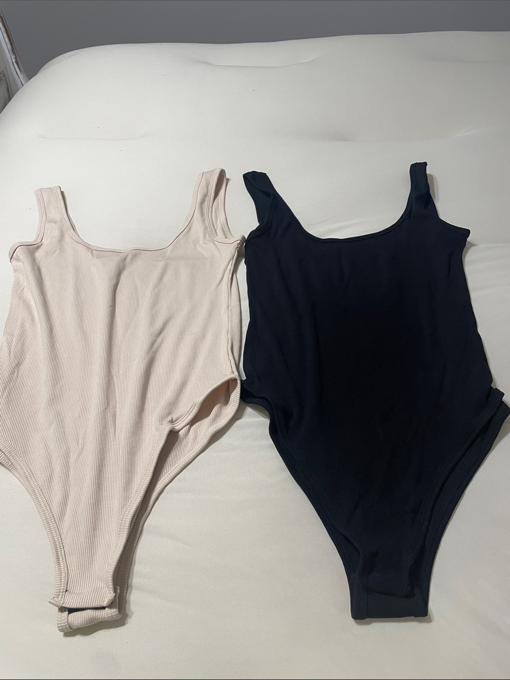 2 Women’s Body Suits. Like new. Size L